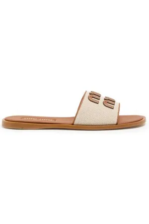 Miu Miu Mules mit Logo aus Leder