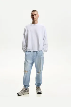 Bershka Jogger-Jeans Mit Zierrissen Herren Xs Hellblau