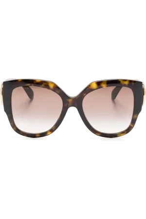 Gucci Runde Sonnenbrille mit Logo-Schild