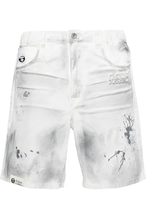 A Bathing Ape Jeans-Shorts mit Farbklecks-Print