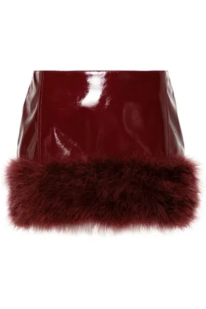 BLUMARINE Lackleder-Minirock mit Federapplikation