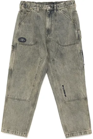 A Bathing Ape Ausgeblichene Jeans mit Moonface-Logo