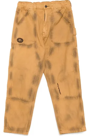 A Bathing Ape Ausgeblichene Jeans mit Moonface-Logo