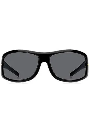 HUGO BOSS Schwarze Sonnenbrille im Masken-Stil mit goldfarbenen Metalldetails