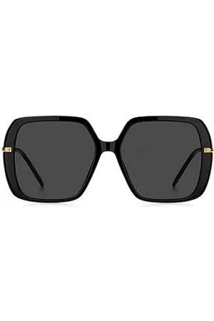 HUGO BOSS Sonnenbrille aus schwarzem, mehrlagigem Acetat mit goldfarbenen Bügeln