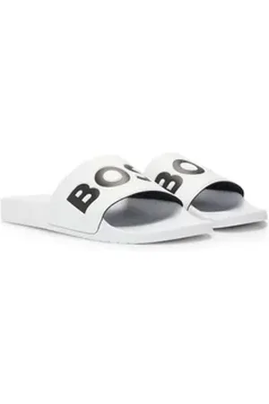 HUGO BOSS Aryeh Slid Badepantolette, Poolslides, Schlappen, Strandschuh, Sommerschuh mit Logoschriftzug beige 45 EU