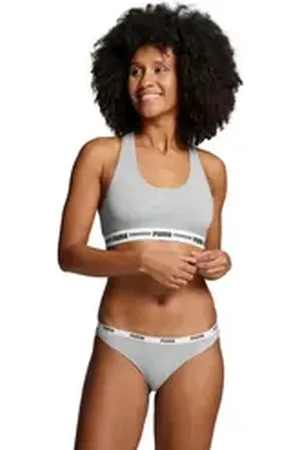 PUMA Sport-Bustier WOMEN RACER BACK TOP 1P HANG mit markantem Logobund grau XS