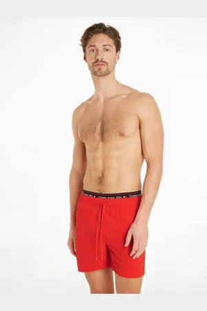 Tommy Hilfiger Badeshorts DW SF MEDIUM DRAWSTRING mit Logostickerein auf dem Bund
